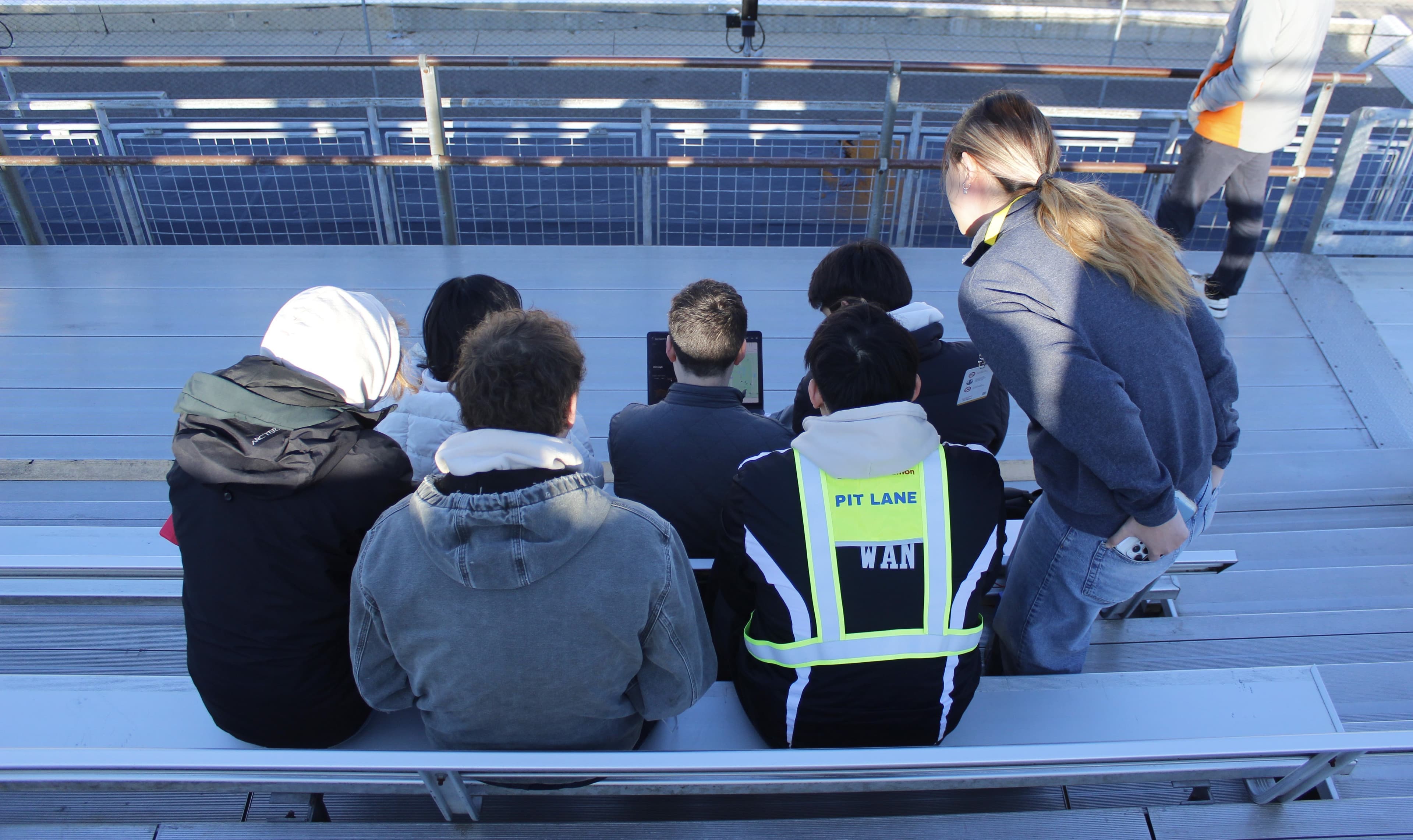 Cornell Electric Vehicles team member working with the vehicle